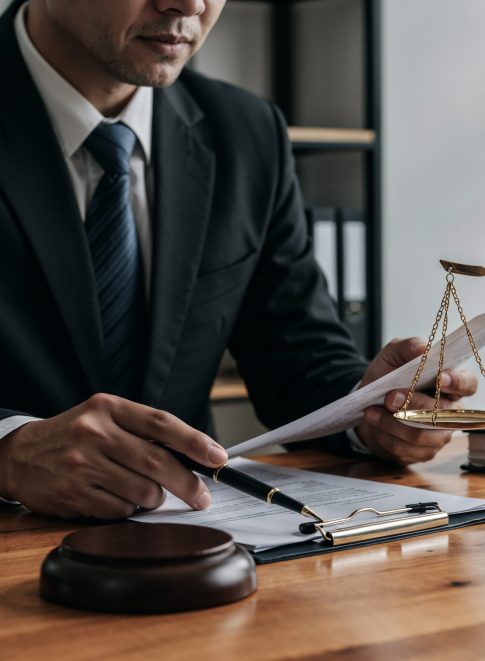 lawyer-working-document-with-scales-justice